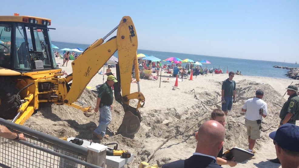 DEM digs up sand in search of beach blast clues WJAR