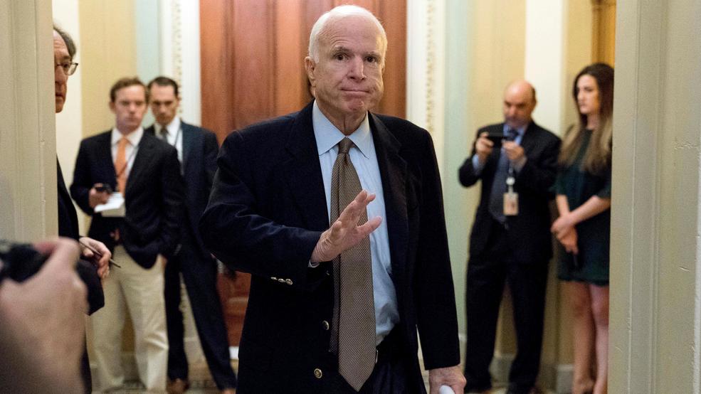 McCain Brain Tumor John McCain faint hand wave hallway AP63.jpg